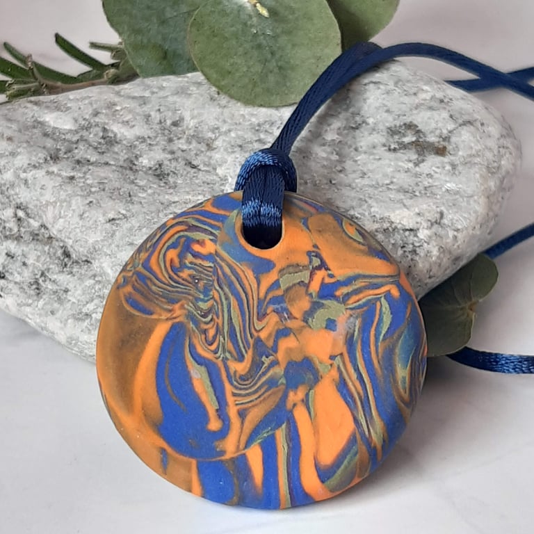 Orange and royal blue polymer clay pendant
