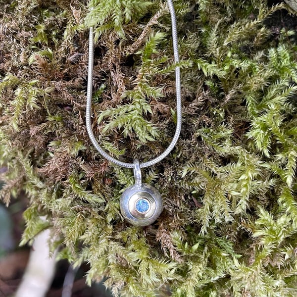 Sterling silver, 18ct gold and aquamarine pendant and chain.