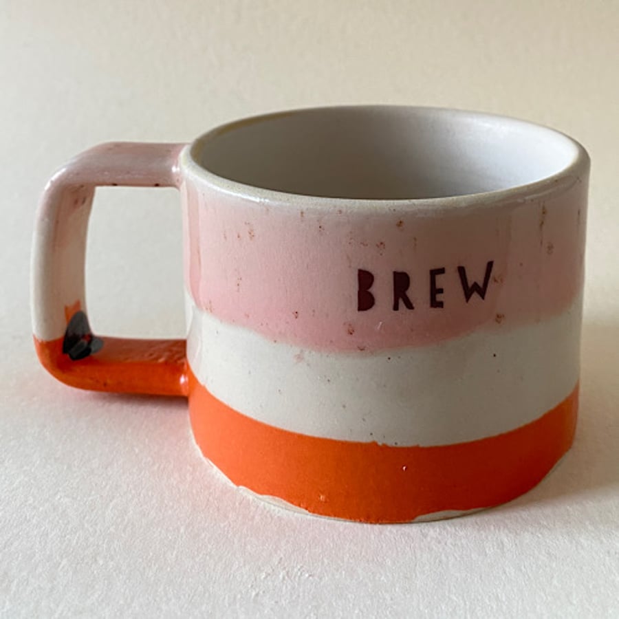 Orange and pink Brew cup