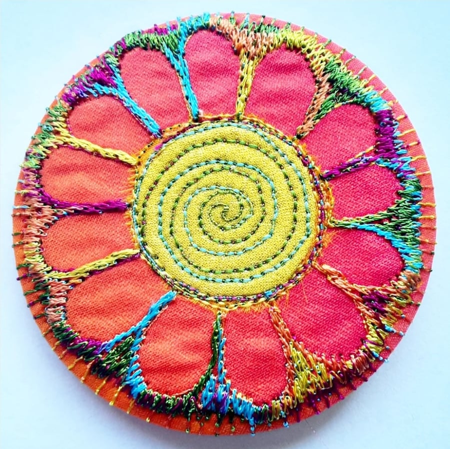 58mm Fabric Badge with Free Machine Embroidery Orange and Gold Flower 