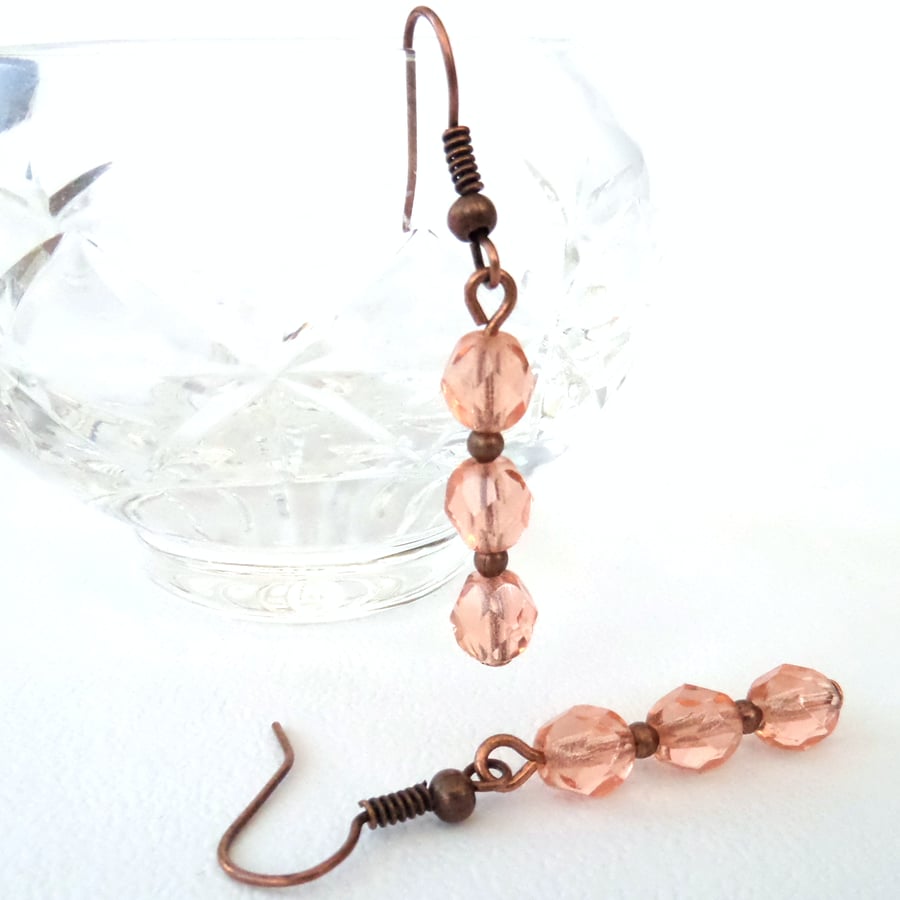 Handmade copper earrings with peach crystal