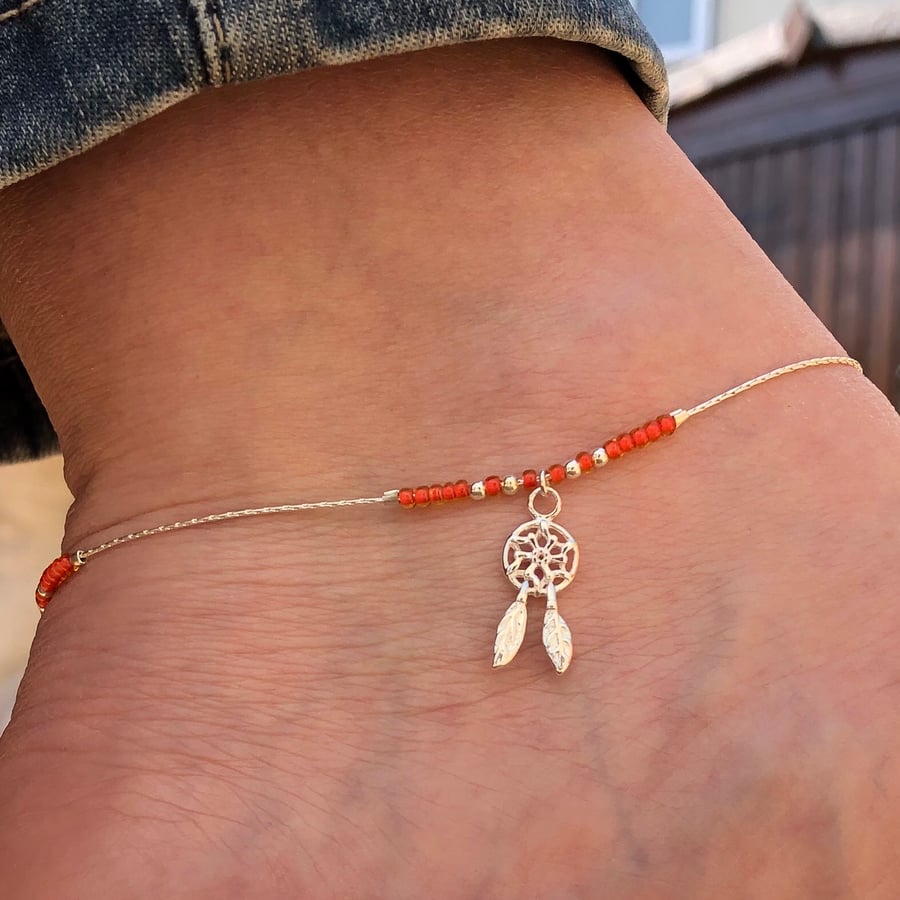 Dream catcher & orange seed bead floating anklet. Sterling silver. 