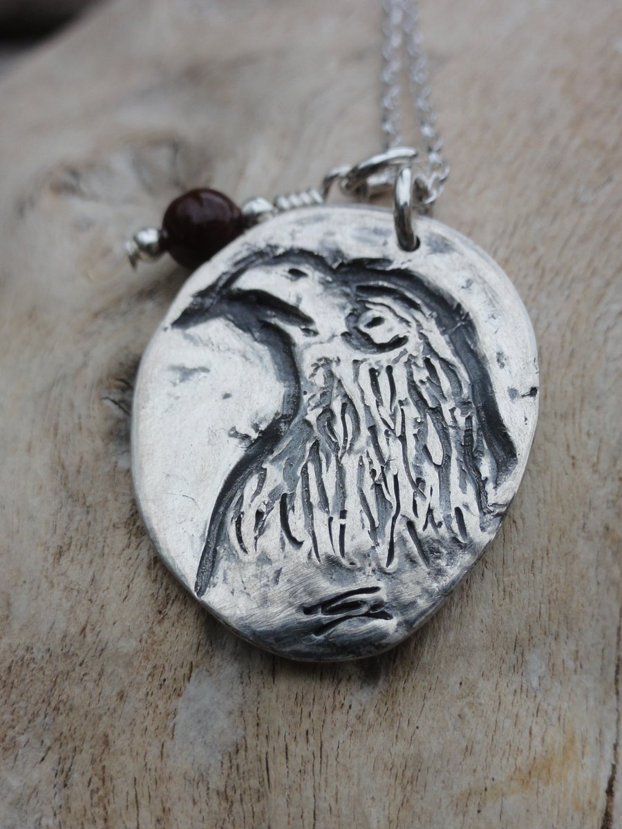 Silver bird of prey pendant