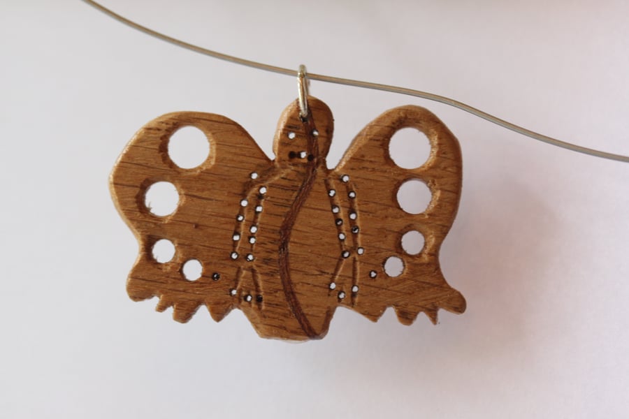 wooden pendant with drilled holes