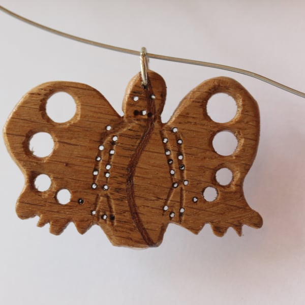 wooden pendant with drilled holes