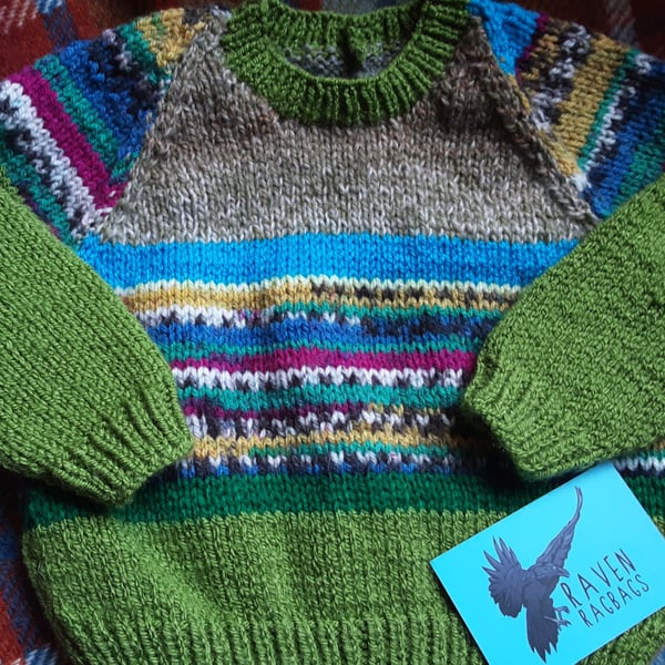 Green patterned hand knitted baby jumper 