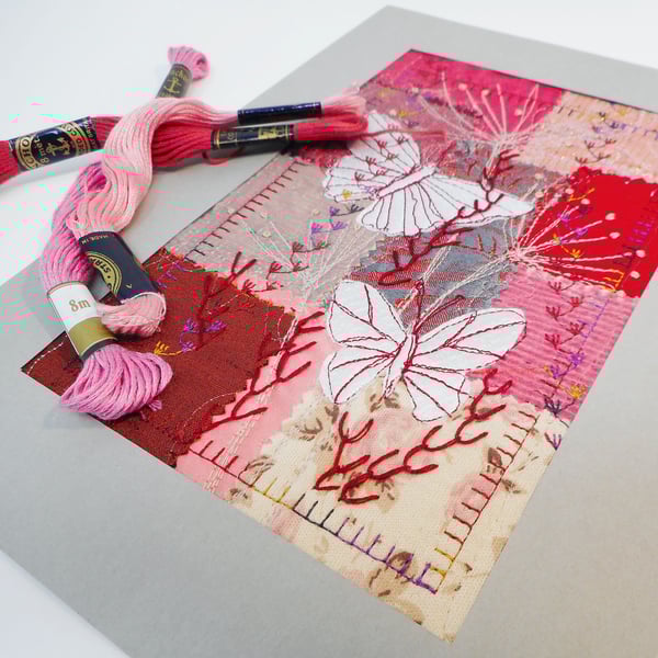 White butterflies on red textile art panel - ready to frame
