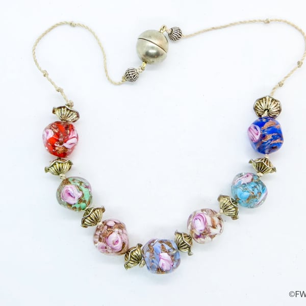 Glass Bead Necklace with Silver Frilly Spacers on White Silk