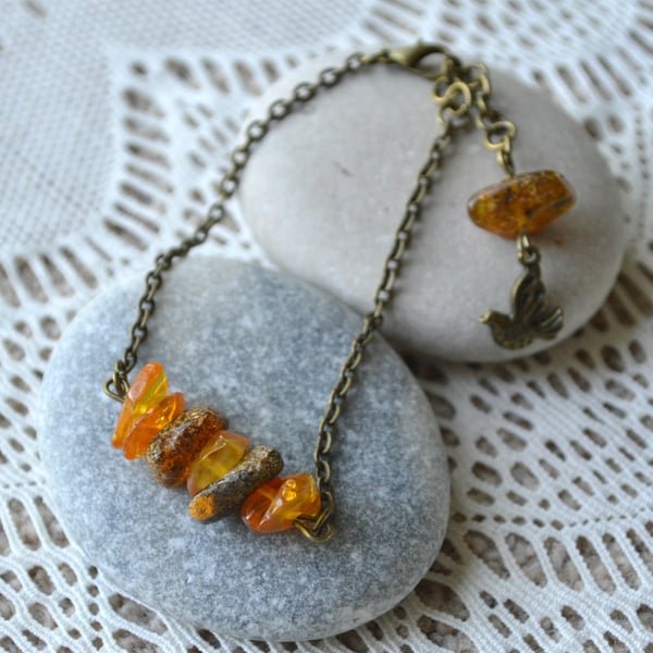 Amber Chip Bead Bracelet with Bird Charm