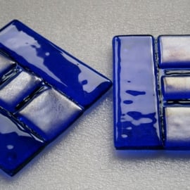 A pair of blue fused glass coasters