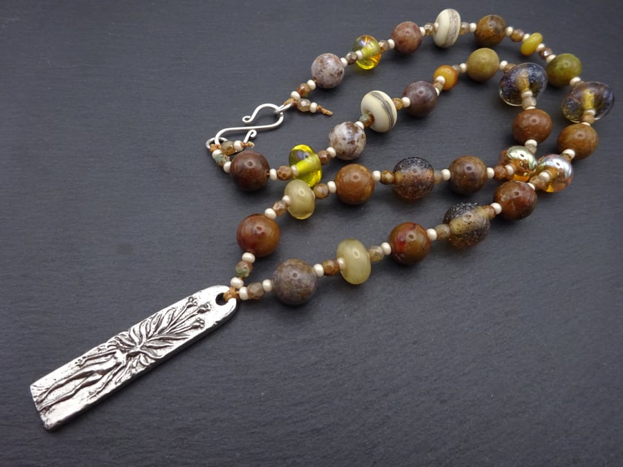 brown lampwork glass beaded necklace, pewter mandrake pendant