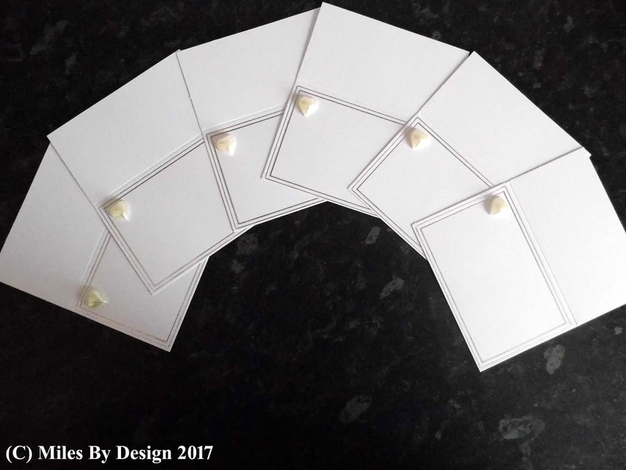 Six Silver & Pearl Place Card Settings