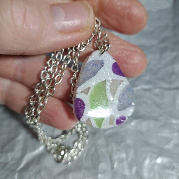 2 designs polymer clay pendant one on a silver plated necklace other rope