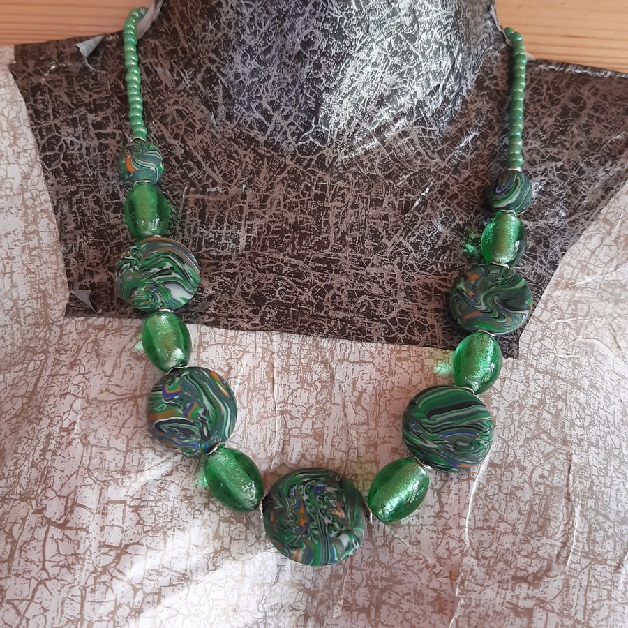 Green multi coloured disc shaped necklace