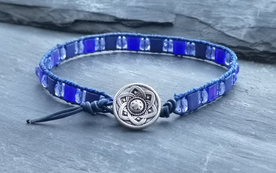 Blue leather and glass bead bracelet with decorative silver button 