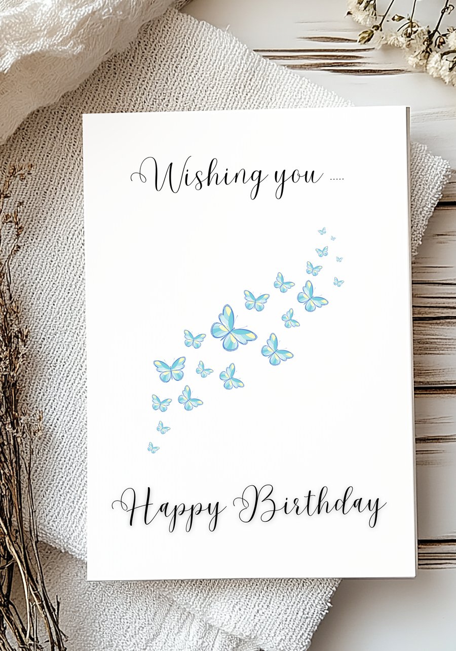Wishing you happy birthday card with  a trail of blue butterflies
