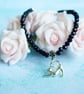 Black Bead Bracelet with Stretching Cat Charm - Image 1