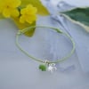 Friendship Bracelet-Apple green cord with silver flower charm