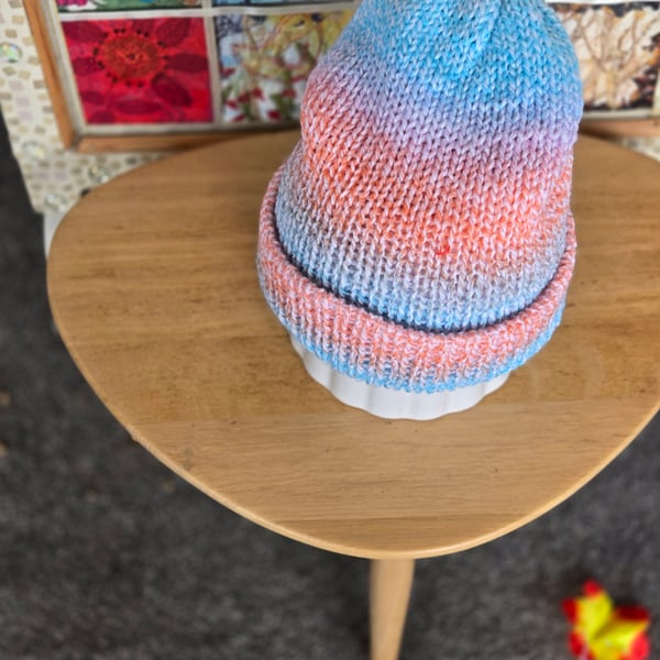 Adult muted orange pink browns and blues hat and scarf