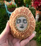  Painted pebble, serene meditation face, with vintage crochet doily - Image 2