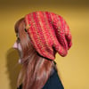 Crocheted Slouch Beanie in Red and other Warm Tones