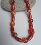 Red Glass Bead Necklace with swirl Design