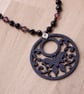 Black butterfly necklace with black and purple beads - Image 2