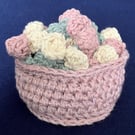 Set of four Rose flower drinking glass or mug coasters in a pink basket