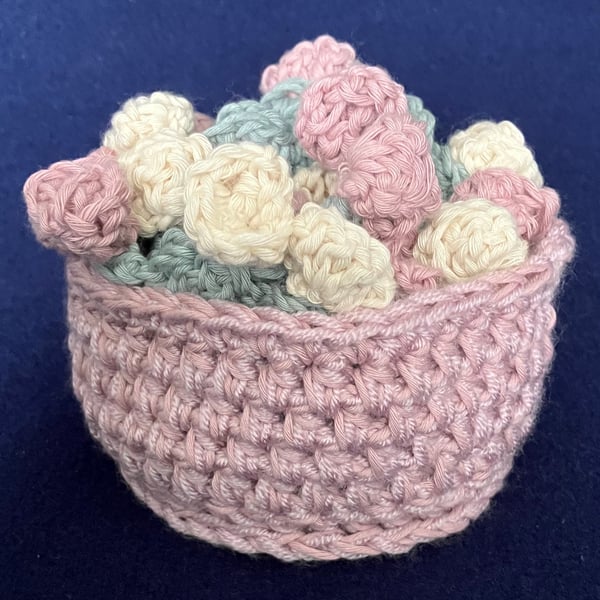 Set of four Rose flower drinking glass or mug coasters in a pink basket