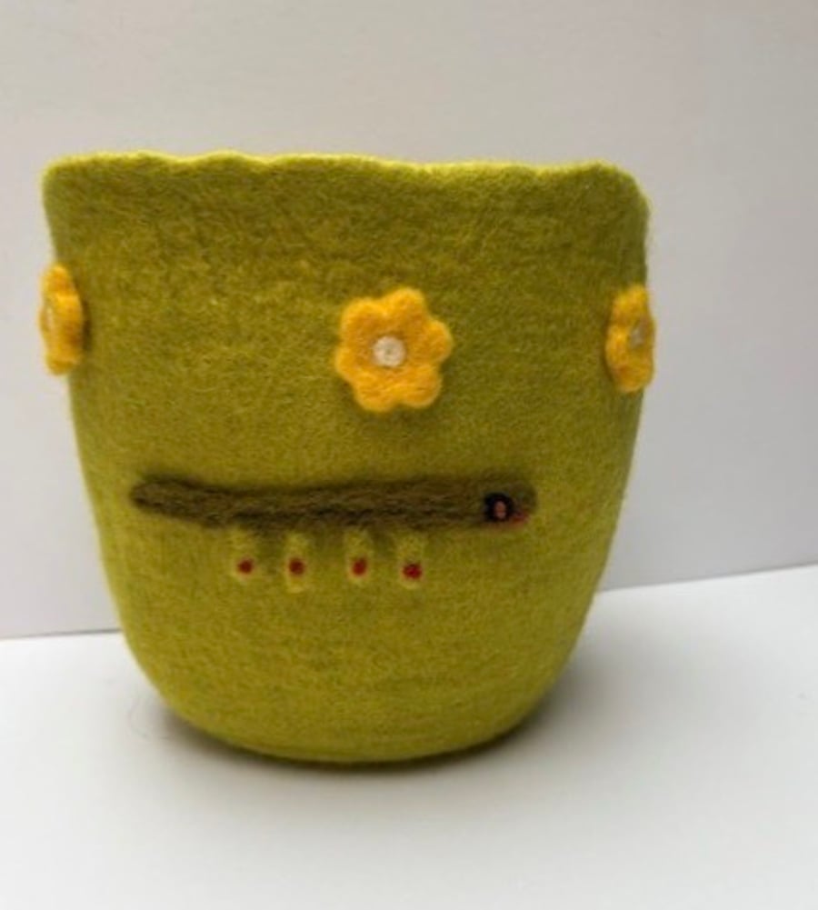 Jolly green plant pot holder.