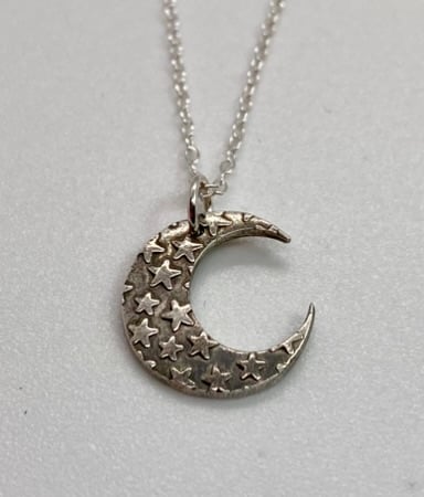 Moon necklace with embossed stars