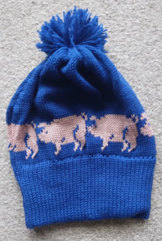 Pig bobble hat for a child with pigs motifs. Machine washable wool, any colour