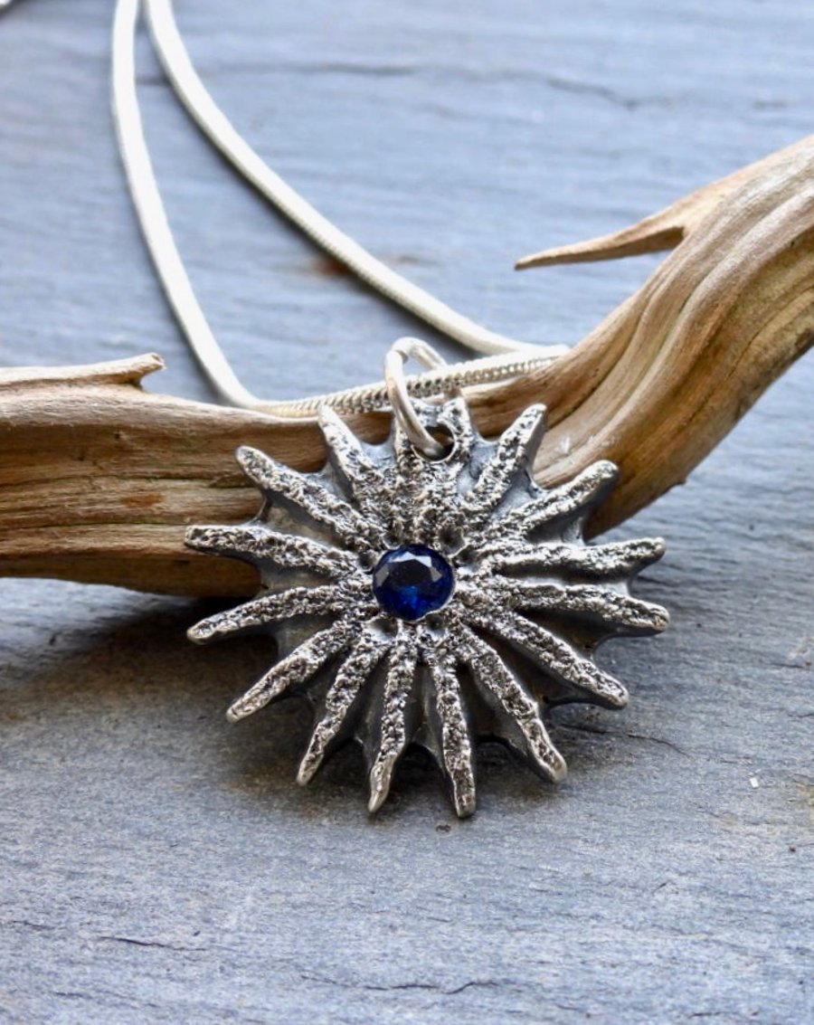 Cast Poppy Seed Head Pendent Necklace With Blue Stone.