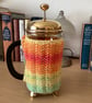 HAND KNITTED CAFETIERE COSY FOR A 1 LITRE POT IN MULTICOLOURED YARN 