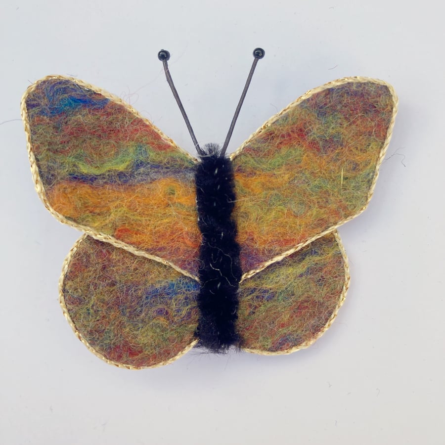 Multicoloured felt butterfly brooch with gold trim