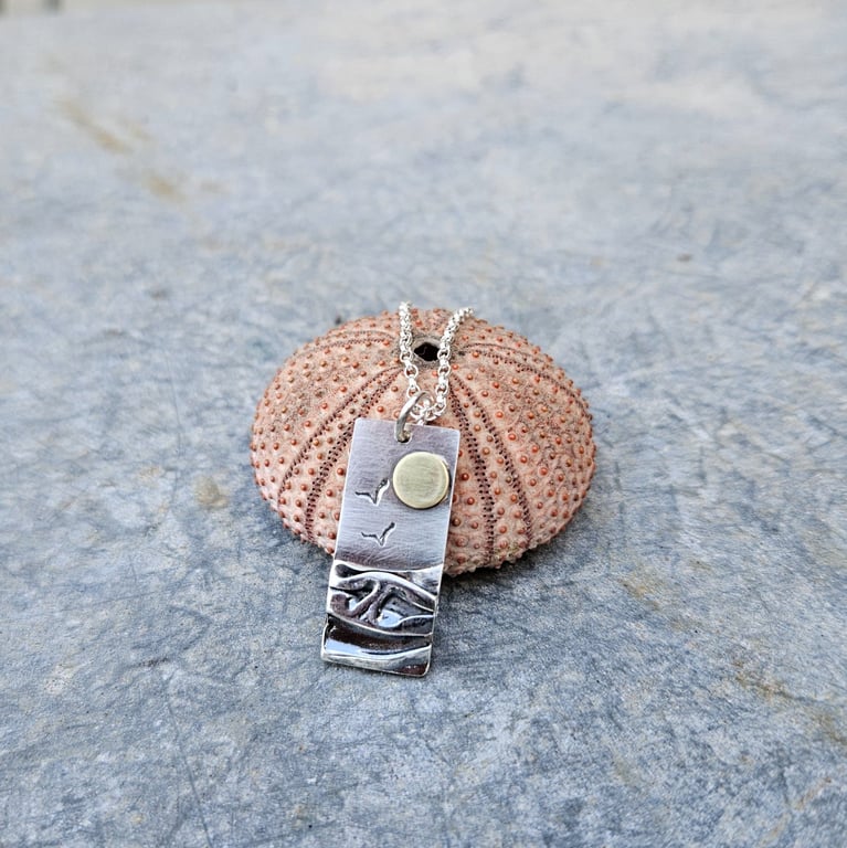 Silver beach, sea coast pendant, with brass sun and seagulls