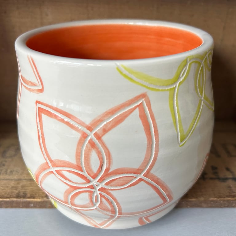 Ceramic hand thrown pot with flower design
