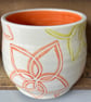Ceramic hand thrown pot with flower design