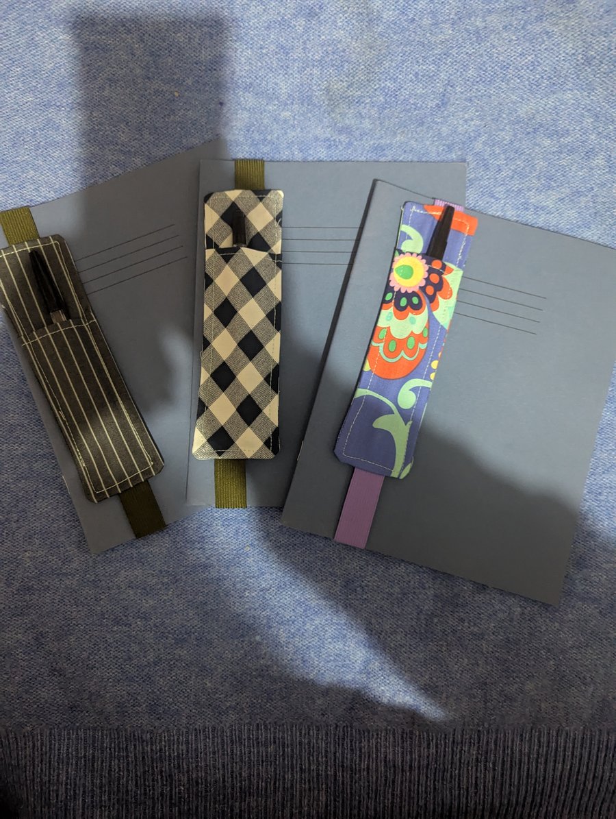 Excersize book with fabric pen holder