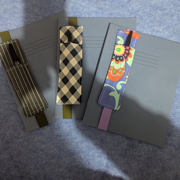 Excersize book with fabric pen holder