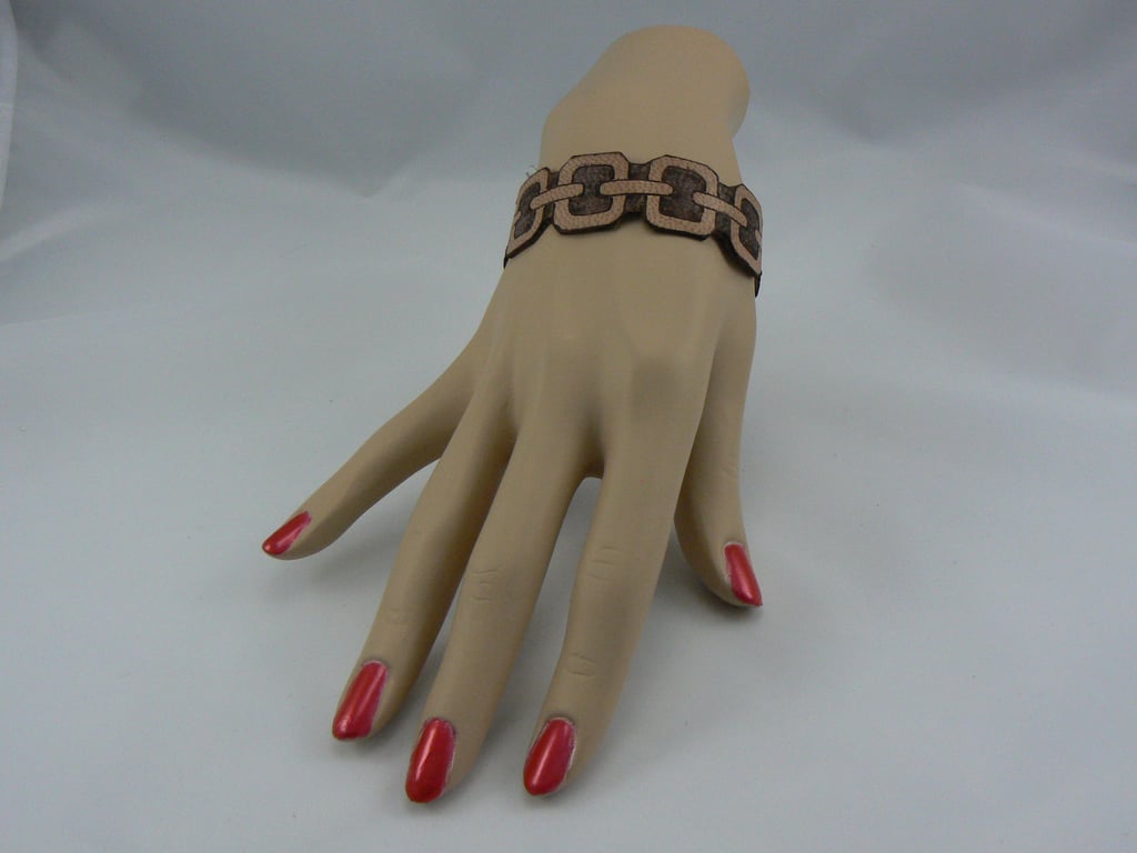 Pyrographed leather bracelet featuring chain design