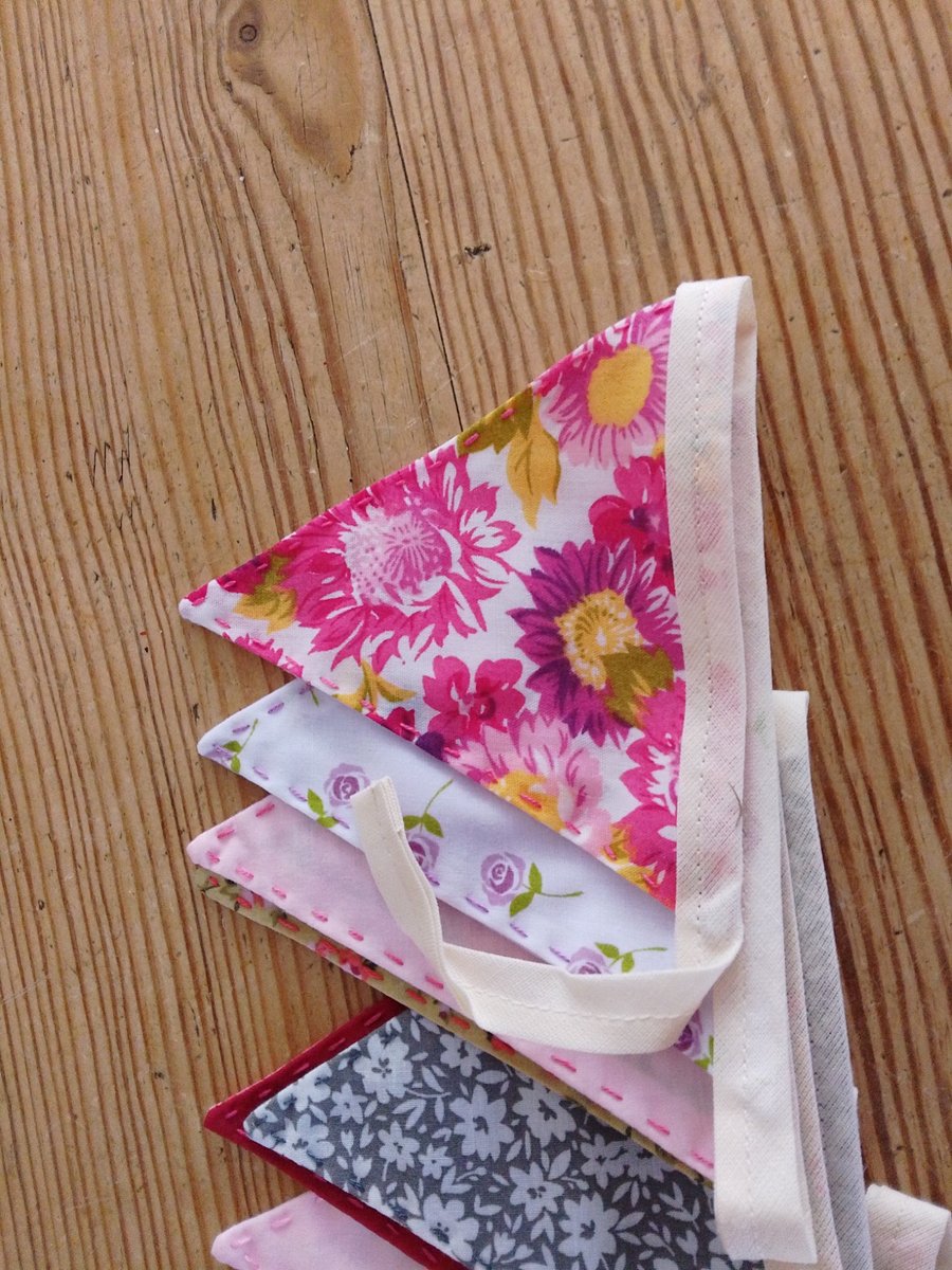 Handmade mini bunting in a pink floral theme.