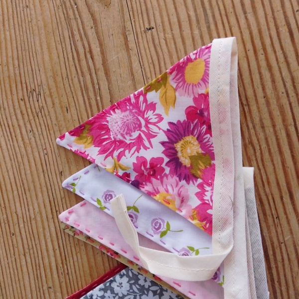 Handmade mini bunting in a pink floral theme.