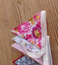 Handmade mini bunting in a pink floral theme.