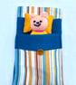 Hand knitted mini bear in bed