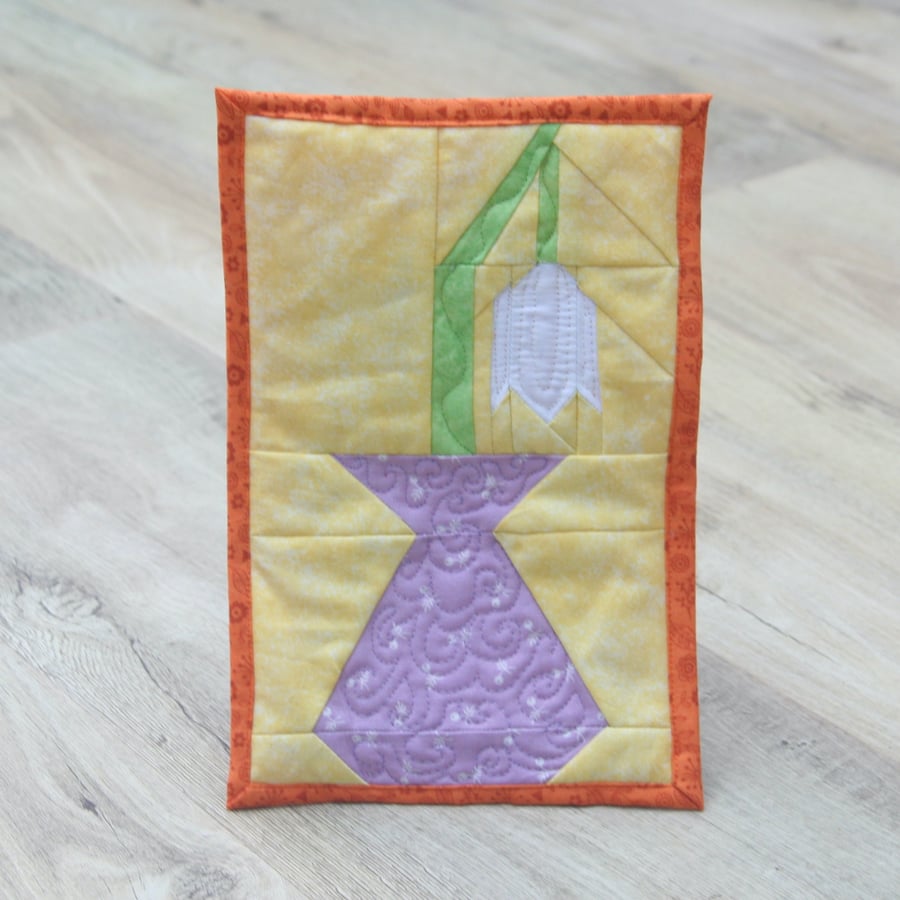 Mug Rug with a Snowdrop in a Vase. 