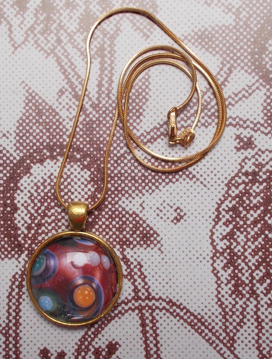 Swirling Colour within a Cabochon Pendant