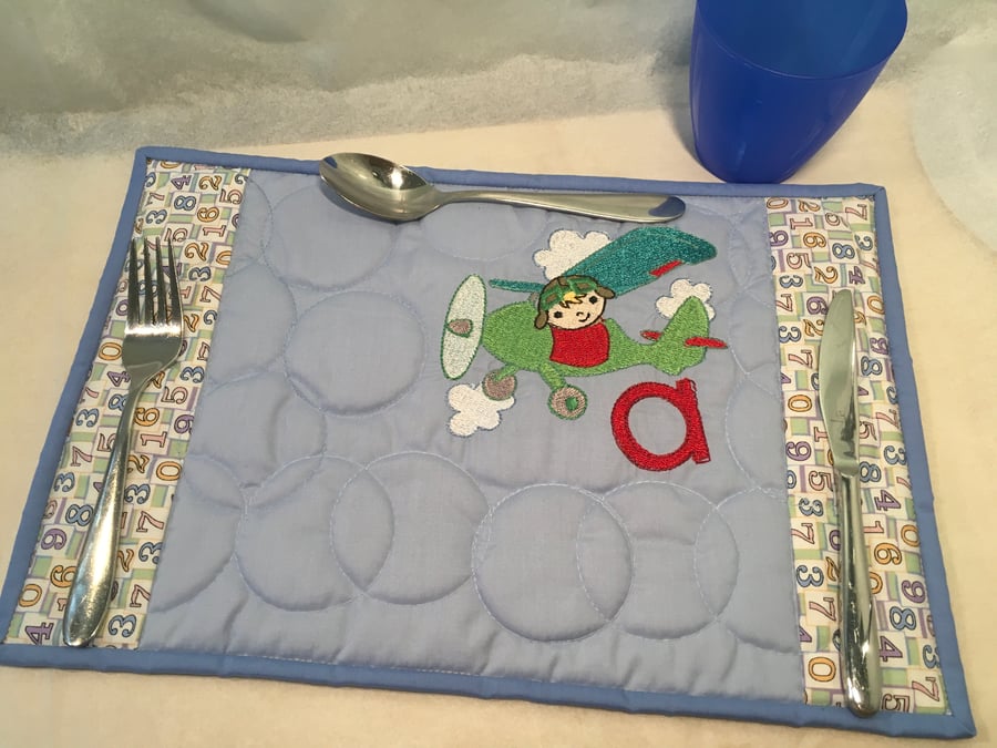 Child’s Place-mat with an Embroidered Picture , some with an Initial.