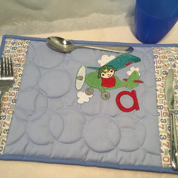 Child’s Place-mat with an Embroidered Picture , some with an Initial.