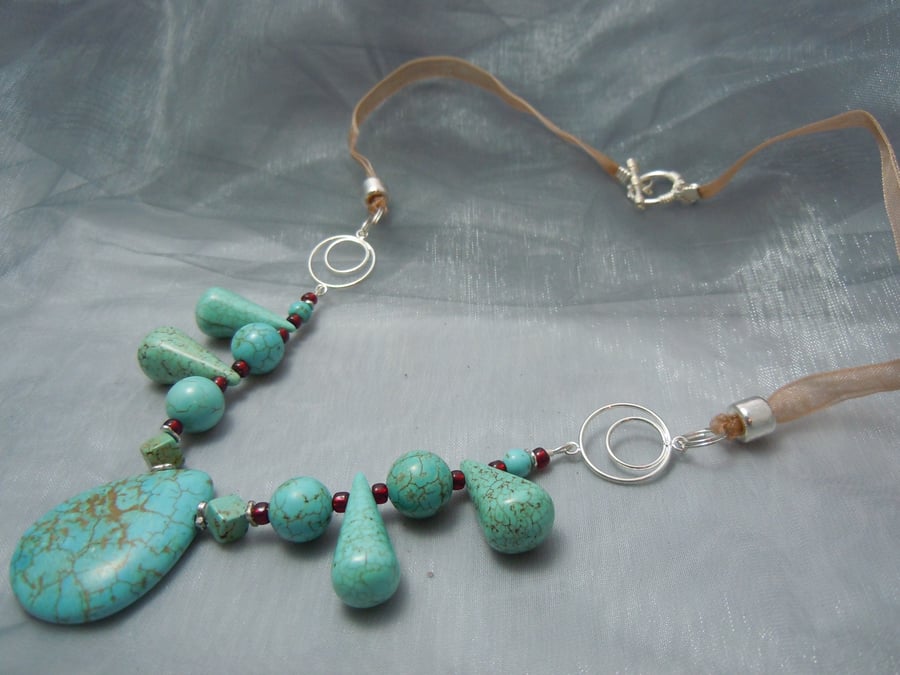 Necklace of assorted shapes of Turquoise beads with glass beads & ribbon
